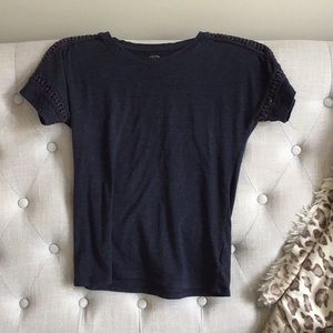 Navy shirt with cut outs on the sleeve